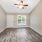 Room with wood flooring and window